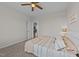 Cozy bedroom with ceiling fan, carpet floors, and light-filled doorway at 540 Pine Ridge Rd, Zebulon, NC 27597
