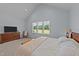 Comfortable bedroom features a large window and soft carpet, providing a peaceful retreat at 540 Pine Ridge Rd, Zebulon, NC 27597