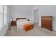 Well-lit bedroom with a comfortable bed, carpet flooring, and ample natural light from the window at 540 Pine Ridge Rd, Zebulon, NC 27597