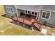 Aerial view of deck featuring black metal railings and a dining table set with grill at 540 Pine Ridge Rd, Zebulon, NC 27597