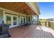 Covered deck with outdoor seating, perfect for enjoying the surrounding view at 540 Pine Ridge Rd, Zebulon, NC 27597