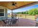 Outdoor deck with furniture and a grill, surrounded by a well-maintained yard at 540 Pine Ridge Rd, Zebulon, NC 27597