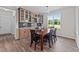 Cozy dining area features a wooden table and chairs, and a large window at 540 Pine Ridge Rd, Zebulon, NC 27597