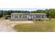 Charming single-story home with gray siding and a covered carport at 540 Pine Ridge Rd, Zebulon, NC 27597