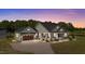 Charming home featuring a covered porch and well-manicured landscaping at 540 Pine Ridge Rd, Zebulon, NC 27597