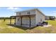 Exterior view of the detached garage with a covered carport, providing ample parking space at 540 Pine Ridge Rd, Zebulon, NC 27597