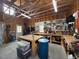 Spacious garage featuring exposed framing, workbench area, and pegboard organizing system for tools at 540 Pine Ridge Rd, Zebulon, NC 27597