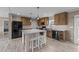 Modern kitchen with a central island, stainless steel appliances, and stylish wooden cabinets at 540 Pine Ridge Rd, Zebulon, NC 27597