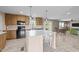 Beautiful kitchen with wooden cabinets, a large island with marble countertops, and modern stainless steel appliances at 540 Pine Ridge Rd, Zebulon, NC 27597
