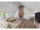 Spacious living room features a stone fireplace, comfortable seating, and ample natural light at 540 Pine Ridge Rd, Zebulon, NC 27597