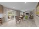 Spacious living room with a fireplace, sliding glass doors to a patio, and ample seating for guests at 540 Pine Ridge Rd, Zebulon, NC 27597