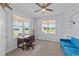 Bright office space featuring a wooden desk, a blue couch and a built-in bookshelf at 540 Pine Ridge Rd, Zebulon, NC 27597