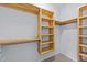 Well-organized walk-in closet with shelves and hanging rods, designed for optimal storage solutions at 540 Pine Ridge Rd, Zebulon, NC 27597