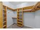 Custom walk-in closet with built-in shelving and ample storage space for organized wardrobe at 540 Pine Ridge Rd, Zebulon, NC 27597