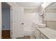 Updated bathroom with a shower-tub combo, white tile, and granite countertops at 5441 Millrace Trl, Raleigh, NC 27606