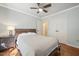 Bedroom featuring a ceiling fan, hardwood floors, and natural light at 5441 Millrace Trl, Raleigh, NC 27606