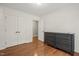 This bedroom features hardwood floors, double closets, and neutral paint at 5441 Millrace Trl, Raleigh, NC 27606
