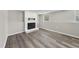 Finished basement features updated floors and a cozy, painted brick fireplace at 5529 Wood Pond Ct, Raleigh, NC 27610