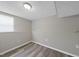 Unfinished basement area featuring updated floors at 5529 Wood Pond Ct, Raleigh, NC 27610