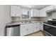 Well-lit kitchen offering ample counter space and a stainless steel dishwasher at 5529 Wood Pond Ct, Raleigh, NC 27610
