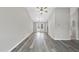 Bright, airy living room with light gray laminate flooring and access to outdoor deck at 5529 Wood Pond Ct, Raleigh, NC 27610