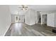 Inviting living area featuring laminate flooring with french doors and staircase at 5529 Wood Pond Ct, Raleigh, NC 27610