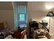 Attic full of boxes and items under a window at 5816 Henner Pl, Durham, NC 27713