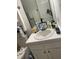 Bathroom vanity cluttered with personal items at 5816 Henner Pl, Durham, NC 27713