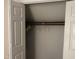 Open closet with a few hangers at 5816 Henner Pl, Durham, NC 27713