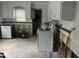 Kitchen shows potential with white cabinets and a window, ready for customization and updates at 5816 Henner Pl, Durham, NC 27713