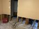 Damaged living room with missing drywall reveals framework, needing repair at 5816 Henner Pl, Durham, NC 27713