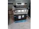 A brand new stainless steel stove ready for installation and use in a kitchen renovation at 5816 Henner Pl, Durham, NC 27713