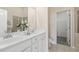 Bathroom with double sinks and white cabinets at 5936 Hourglass Ct, Raleigh, NC 27612