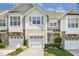 Attractive townhome with a one car garage and inviting landscaping at 5936 Hourglass Ct, Raleigh, NC 27612