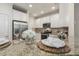 Bright kitchen featuring granite counters, stainless steel appliances, and white cabinets at 5936 Hourglass Ct, Raleigh, NC 27612