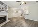 Open-concept living room with a fireplace and hardwood floors at 5936 Hourglass Ct, Raleigh, NC 27612