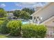 Community pool area surrounded by lush landscaping, providing a perfect spot for relaxation and recreation at 5936 Hourglass Ct, Raleigh, NC 27612