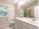 Bright bathroom boasts double sinks, a walk-in shower, and a soaking tub for relaxation at 6206 Braidwood Court Ct, Raleigh, NC 27612