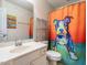 Bright bathroom with a playful dog-themed shower curtain and a clean, modern vanity at 6206 Braidwood Court Ct, Raleigh, NC 27612