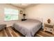 Relaxing bedroom with natural light, neutral walls, and a comfortable king-size bed at 6206 Braidwood Court Ct, Raleigh, NC 27612