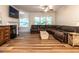 Comfortable living room with fireplace, tv, and wood floors for a cozy ambiance at 6206 Braidwood Court Ct, Raleigh, NC 27612