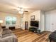 Inviting living room with hardwood floors, ceiling fan, and comfortable seating at 6206 Braidwood Court Ct, Raleigh, NC 27612