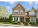 Charming two-story townhome boasts a beautifully landscaped yard and inviting front entrance with craftsman details at 6236 Pesta Ct, Raleigh, NC 27612