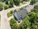 Aerial view of home featuring a backyard patio with outdoor seating and mature landscaping at 712 Brittley Way, Apex, NC 27502