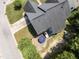 Aerial view of home featuring a backyard patio with outdoor seating and mature landscaping at 712 Brittley Way, Apex, NC 27502