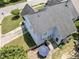 Aerial view of home featuring a backyard patio with outdoor seating and mature landscaping at 712 Brittley Way, Apex, NC 27502