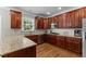 Kitchen with stainless steel appliances, granite countertops, and custom cabinets at 712 Brittley Way, Apex, NC 27502