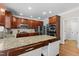 Kitchen features stainless steel appliances, granite counters, and a large island at 712 Brittley Way, Apex, NC 27502