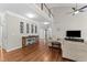 Open living room featuring a high ceiling and hardwood floors at 712 Brittley Way, Apex, NC 27502