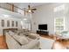 Spacious living area with hardwood floors, a vaulted ceiling, and a second-floor overlook at 712 Brittley Way, Apex, NC 27502